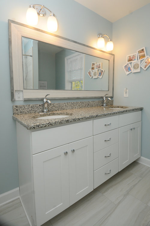 modern bathroom with white vanity and double sink