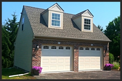 detached two car garage with brick construction