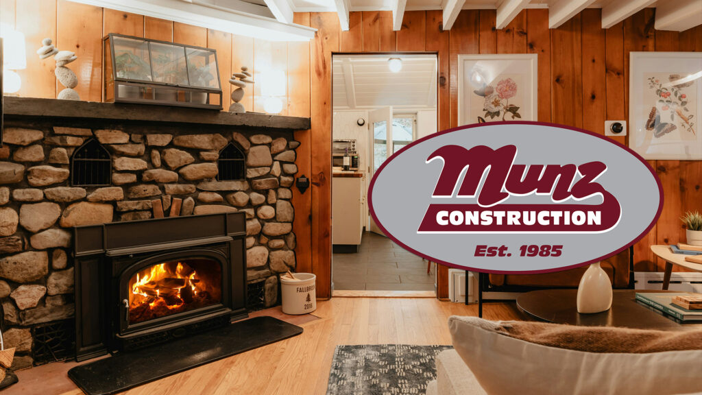 Fireplace in a cozy room with Munz Logo